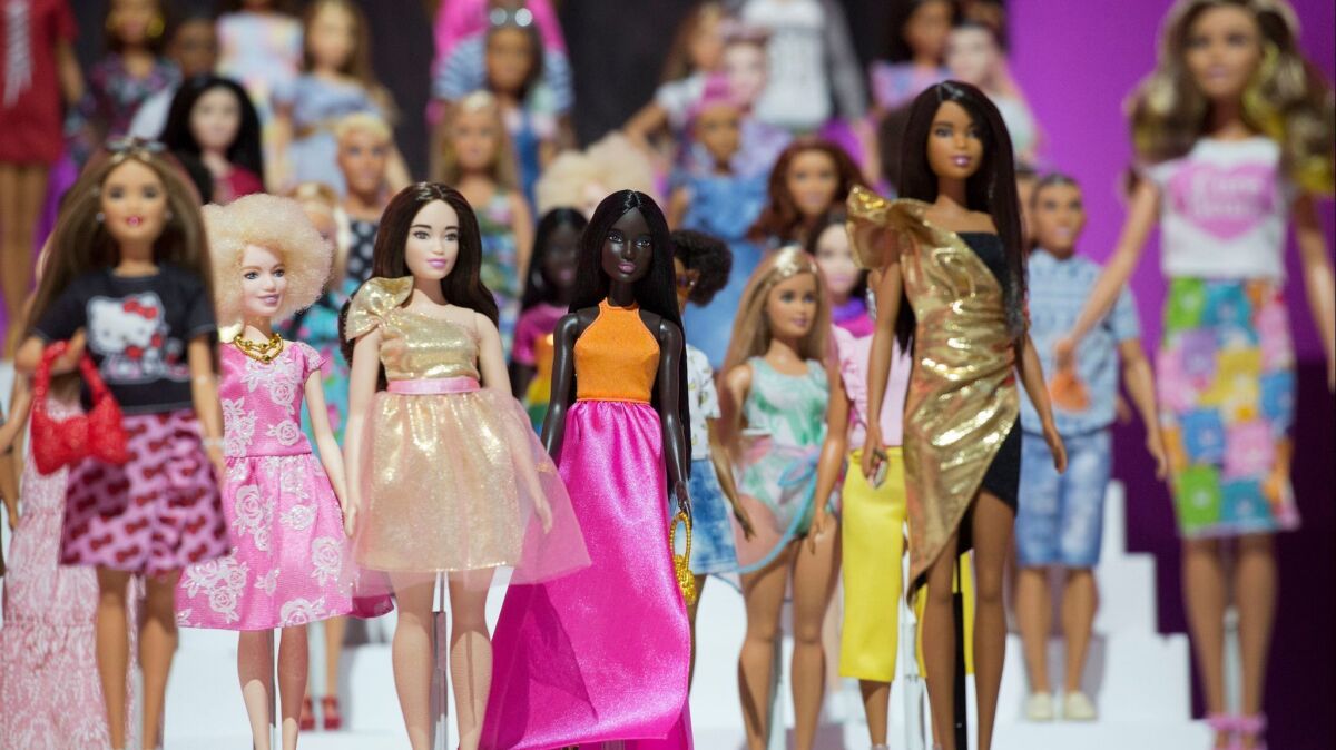 Dozens of Barbie dolls are displayed at the Mattel showroom at Toy Fair in New York in February.
