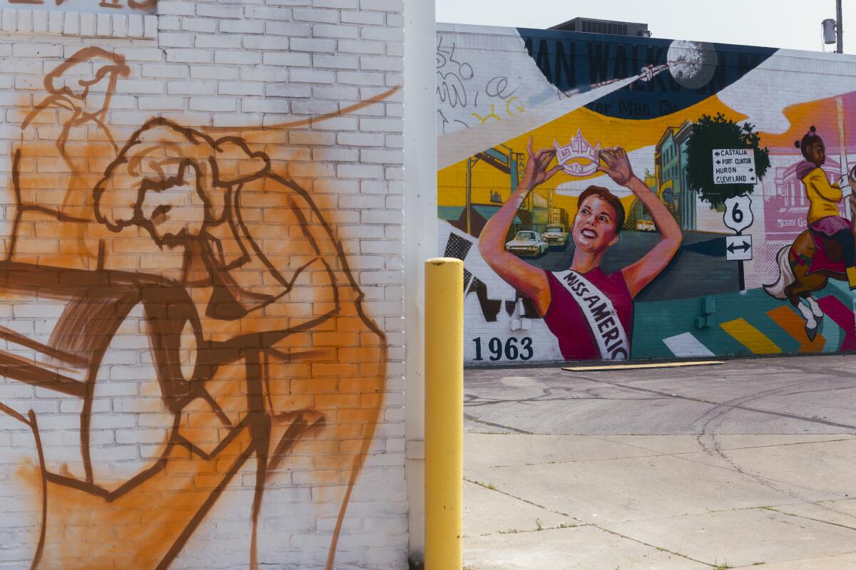 murals and paintings decorate brick walls