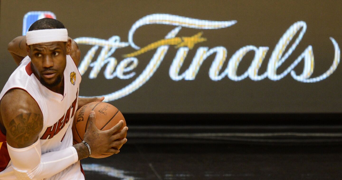 LeBron James helped the Miami Heat win two NBA titles in four Finals appearances.