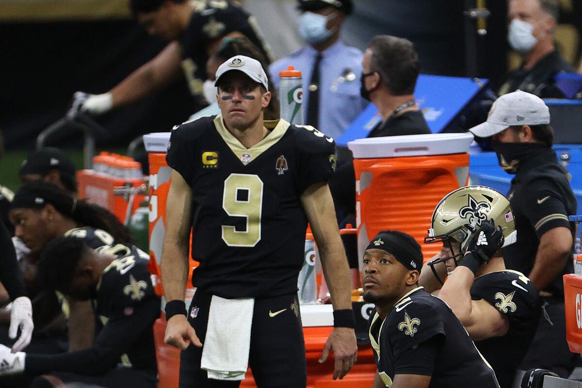 After getting hurt Drew Brees (9) gave way to Jameis Winston (right) for the second half of Sunday's Saints-49ers game.