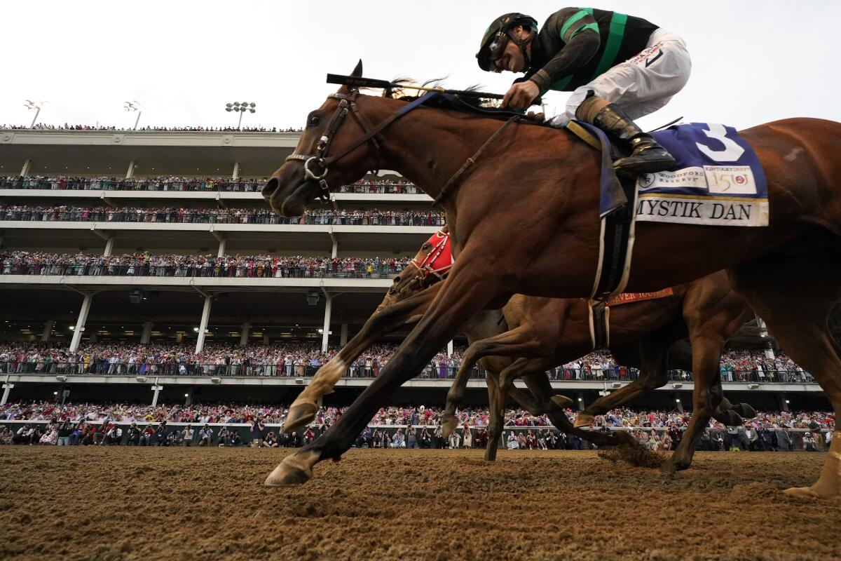 Brian Hernandez Jr. rides Mystik Dan across the finish line to win the 150th running of the Kentucky Derby