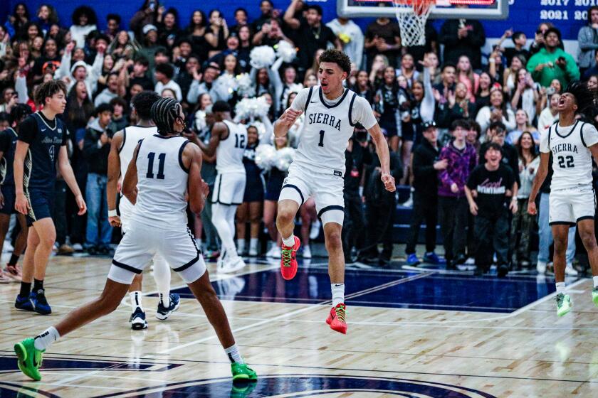 Justin Pippen celebrates with his Sierra Canyon teammates after his team rallies from a 17-point fourth-quarter deficit