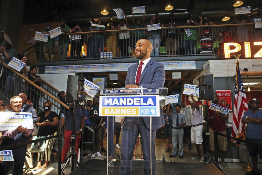 Wisconsin Lt. Governor, Mandela Barnes takes in the crowd before announcing that he will be running for U.S. Senate at the Sherman Phoenix on Tuesday, July 20, 2021, in Milwaukee. Barnes has joined the crowded Democratic field for the U.S. Senate seat currently held by Republican Sen. Ron Johnson. (Angela Peterson/Milwaukee Journal-Sentinel via AP)