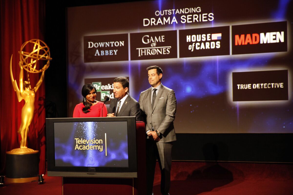 Carson Daly, right, and Mindy Kaling, right, join Television Academy Chairman and CEO Bruce Rosenblum to announce the 66th Primetime Emmy Awards nominations.