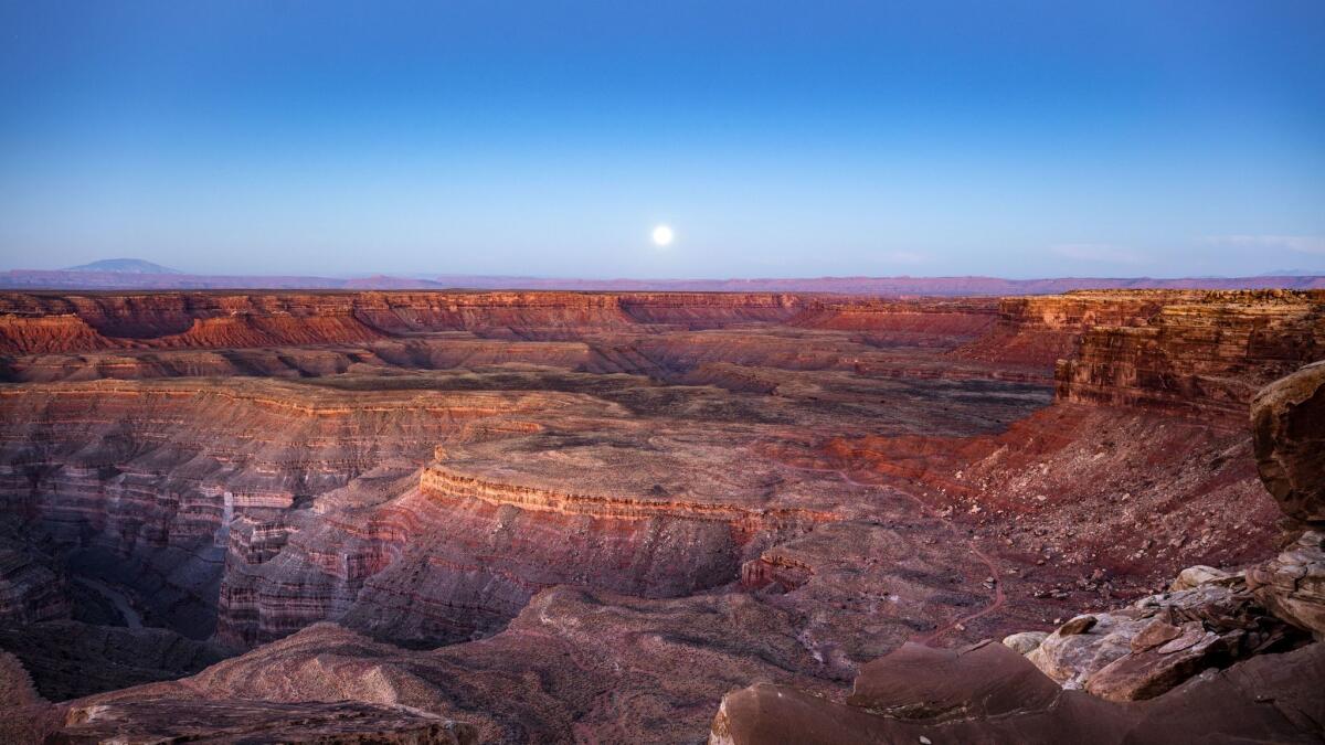 A full moon shines behind Cedar Mesa, which is within Bears Ears National Monument in Utah.