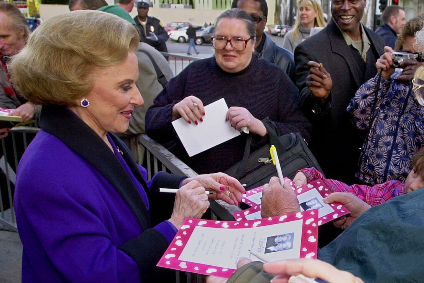 Pauline Friedman Phillips signs autographs after the dedication of a "Dear Abby" star on the Hollywood Walk of Fame.
