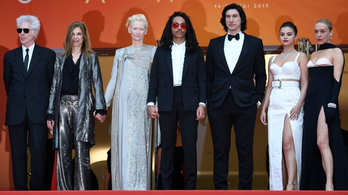 Jim Jarmusch, from left, Sara Driver, Tilda Swinton, Luka Sabbat, Adam Driver, Selena Gomez and Chloë Sevigny arrive at the Cannes premiere of "The Dead Don't Die."