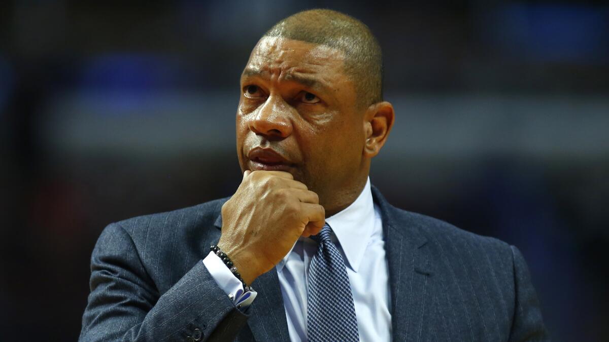 Clippers Coach Doc Rivers looks at the scoreboard during a March 1 game against the Bulls in Chicago.