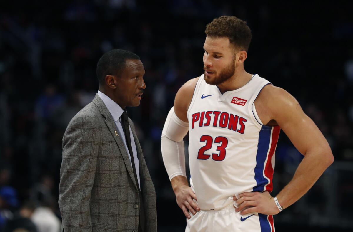 Pistons coach Dwane Casey talks to forward Blake Griffin during the second half of their victory over the Cavaliers on Nov. 19.