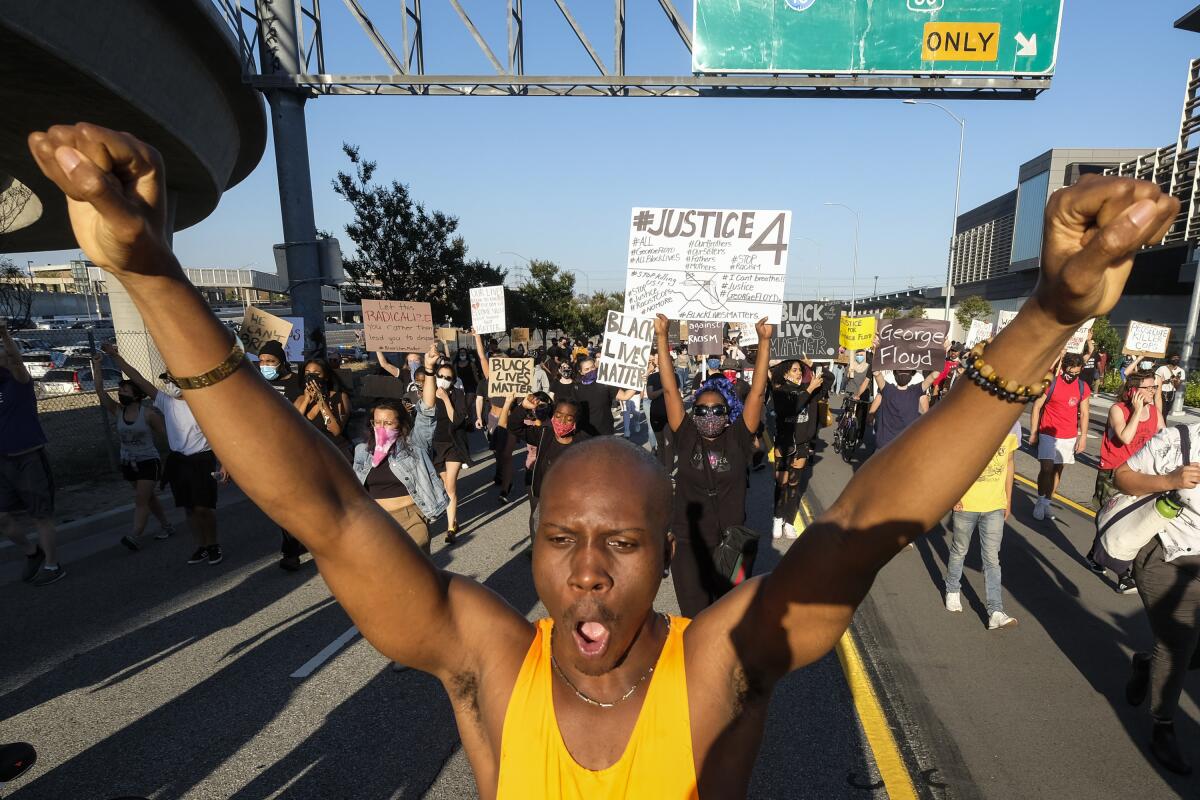 Demonstrators march in Los Angeles last May in memory of George Floyd