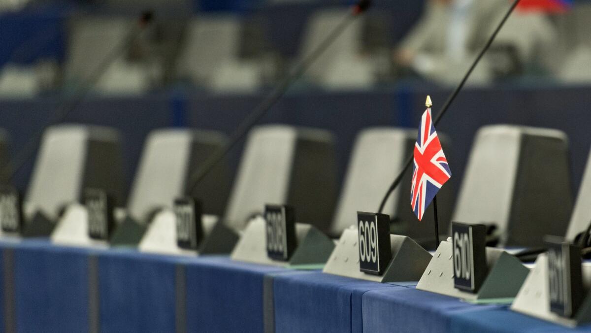 A single British flag sits on a desk during a debate in the European Parliament in Strasbourg, France.