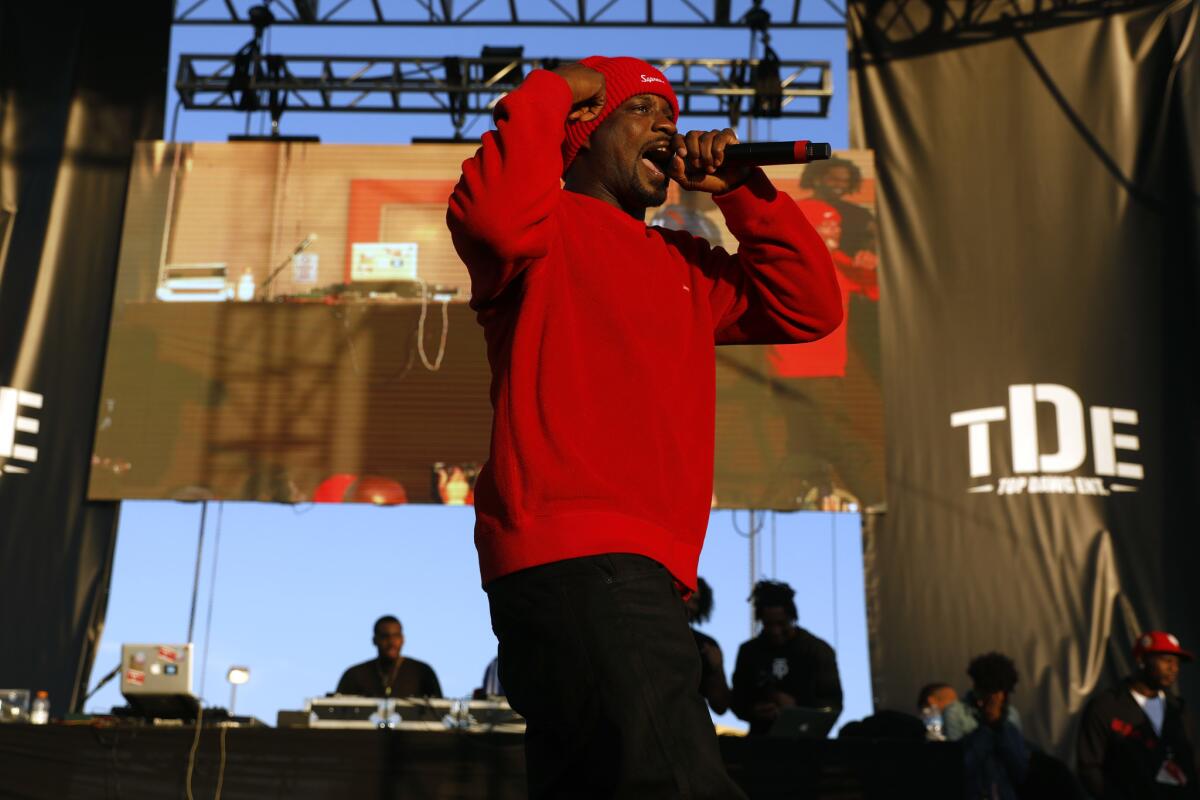 Jay Rock performs at the annual Top Dawg concert and toy drive.