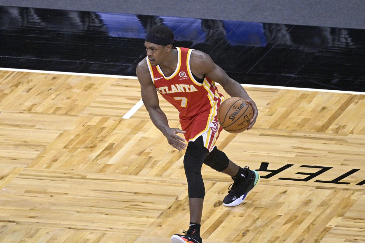 Rajon Rondo sets up a play for the Atlanta Hawks against the Orlando Magic on March 3, 2021, in Orlando, Fla.