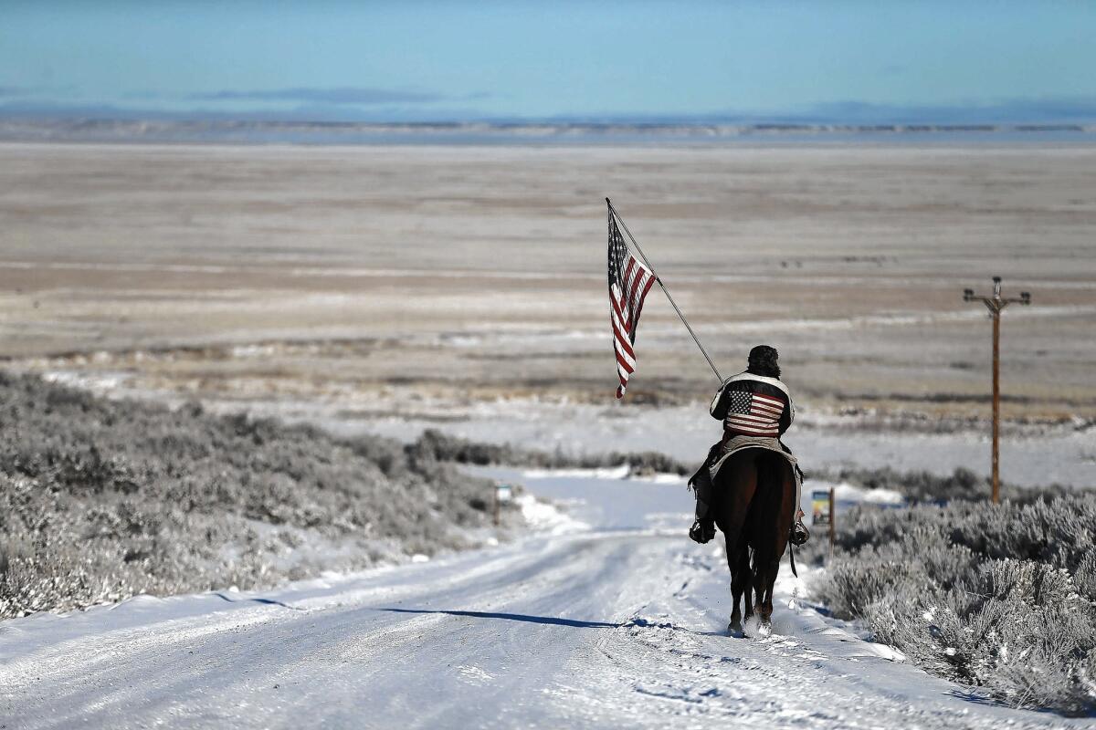 One of the occupiers on Jan. 15, in the early stage of the 41-day standoff at the Malheur National Wildlife Refuge in Oregon. The roads to the refuge, which had been closed after the occupation, have now reopened.