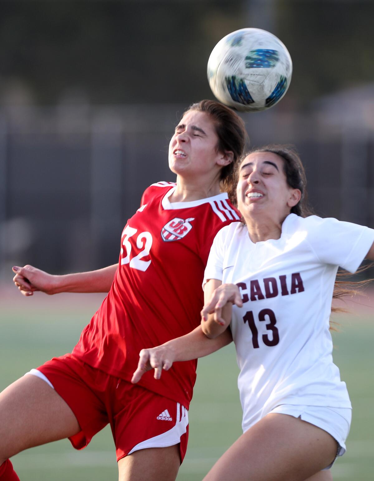 Burbank girls soccer player Jessie Virtue, left, battles for the ball in game vs. Arcadia, at home in Burbank on Tuesday, Jan. 7, 2020.