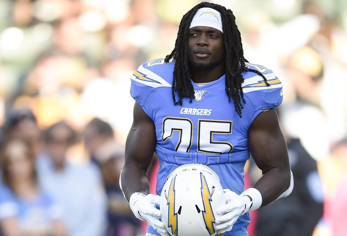 Chargers running back Melvin Gordon, holding his helmet in front of him, hasn’t rushed for more than 42 yards in a game since Nov. 25.