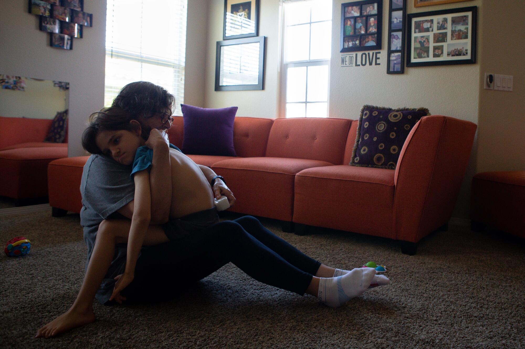 Mary Cunningham spends every weekday with grandson Connor Dalby guiding him through a series of exercises. 