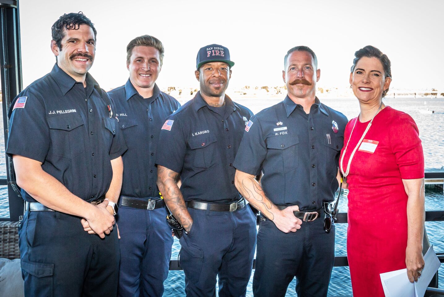San Diego Fire-Rescue firefighters Joe Pellegrini, Brandon Hill, Ivan Kargbo and Rob Fox with PB Town Council President Marcella Bothwell.