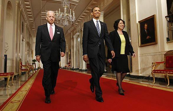 President Obama and Vice President Joe Biden escort federal judge Sonia Sotomayor to the White House East Room for the announcement of her nomination to the Supreme Court.