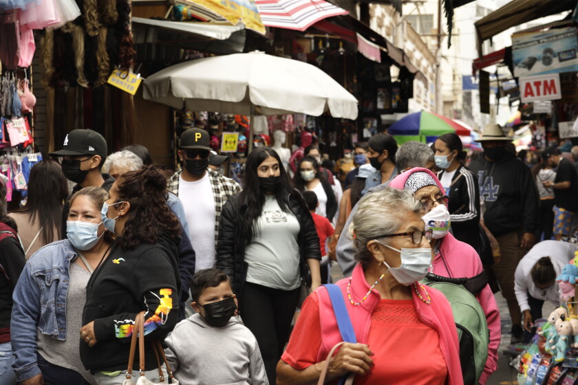 L.A.'s COVID-19 death rate falls below that of Bay Area in
another sign of widening recovery 4 LOS ANGELES, CA - JUNE 7, 2021 - - Shoppers make their way through Santee Alley in downtown Los Angeles on June 7, 2021. California continues to help set the pace for U.S. COVID-19 recovery, now ranked by the Centers for Disease Control and Prevention as one of just two states at the lowest level of coronavirus community transmission. In fact, according to the CDC's four-level color-coded system, California's transmission metrics were the lowest out of all 50 states as of Saturday. The CDC determines the level of community transmission based on the number of cases in the last seven days per population of 100,000, and the number of tests in the last seven days that yield a positive result. JUNE 07: Los Angeles Monday, June 7, 2021 Los Angeles, CA. (Genaro Molina / Los Angeles Times)