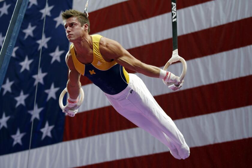 Sam Mikulak, shown at U.S. men's national gymnastics championships in August, leads in the standings after the first of four subdivisions at the World Gymnastics Championships in Antwerp, Belgium.
