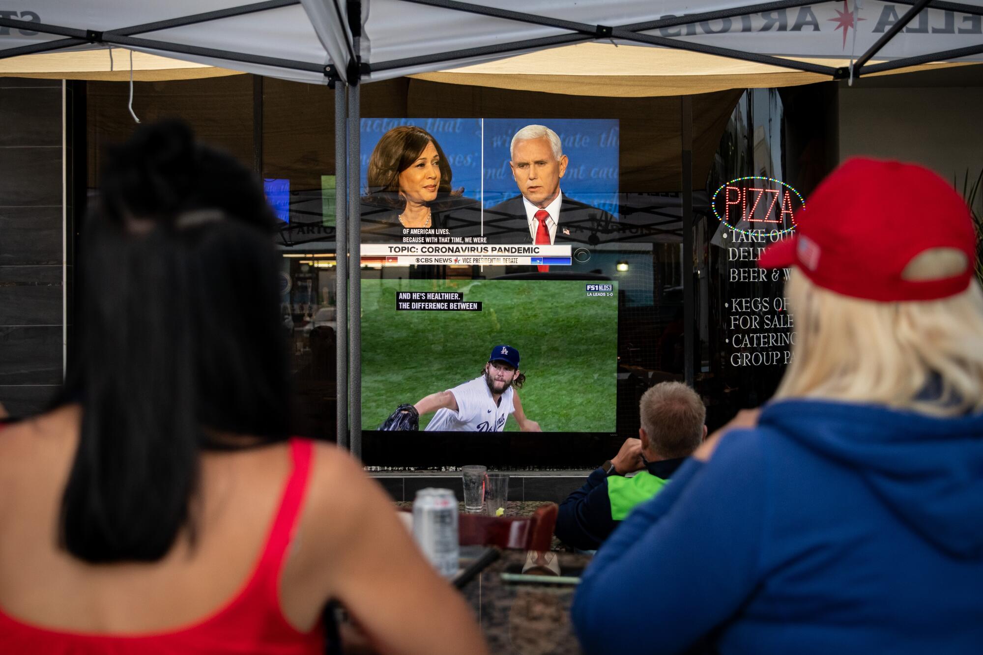 TVs show the debate and the Dodgers playoff game