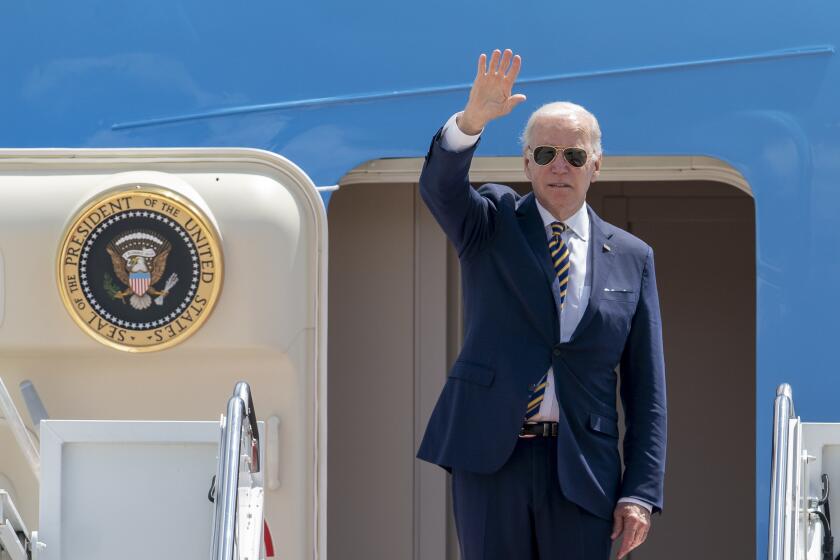 President Joe Biden waves as he boards Air Force One at Andrews Air Force Base, Md., Thursday, May 19, 2022, to travel to Seoul, Korea to begin his first trip to Asia as President. (AP Photo/Gemunu Amarasinghe)