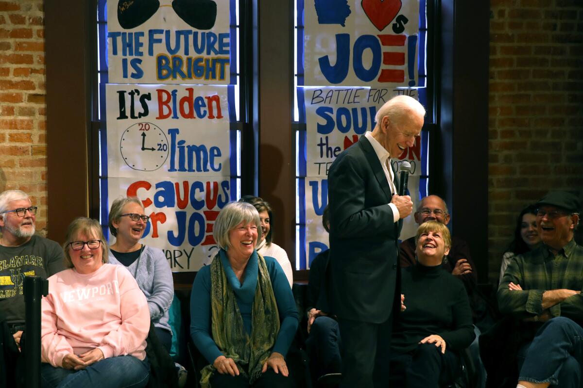 Democratic presidential candidate former Vice President Joe Biden laughs with members of the audience during a campaign event at Vince Meyer Learning Center in Newton, Iowa.