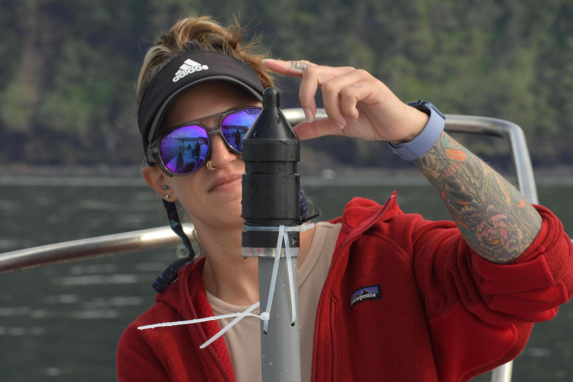 Researcher Audra Ames syncing a hydrophone.