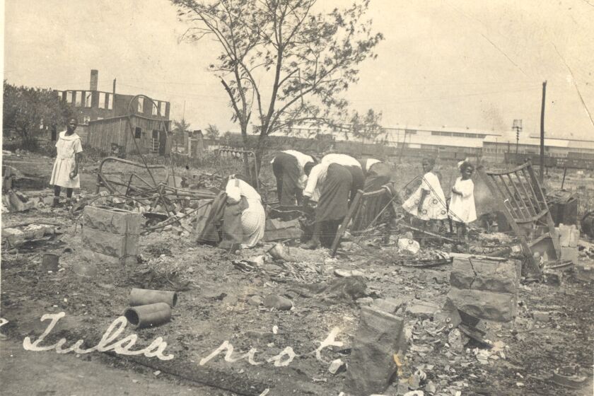 Photograph of people searching through rubble after the Tulsa Race Riot, Tulsa, Oklahoma, June 1921. (Photo by Oklahoma Historical Society/Getty Images)