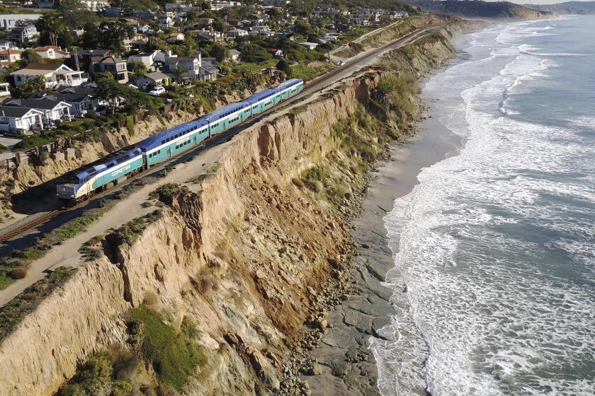 Erosion of the bluffs above the beach in Del Mar could put nearby train tracks in jeopardy.