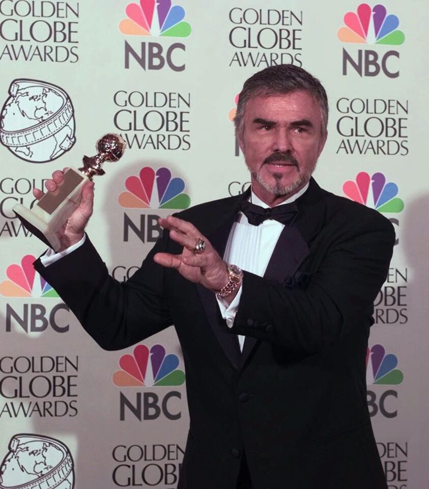 "Boogie Nights" star Burt Reynolds holds his award for supporting actor in a motion picture at the Golden Globe Awards in Beverly Hills on Jan. 18, 1998.