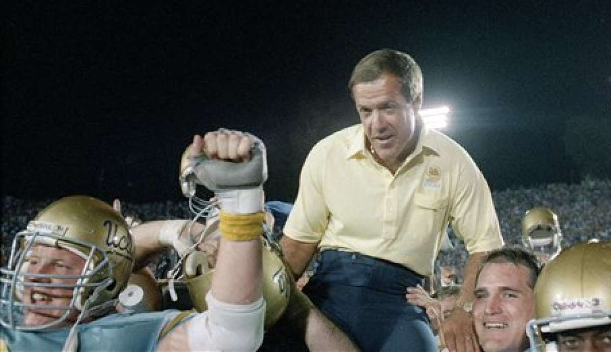 UCLA coach Terry Donahue is carried off the field following his 100th win as Bruins coach.