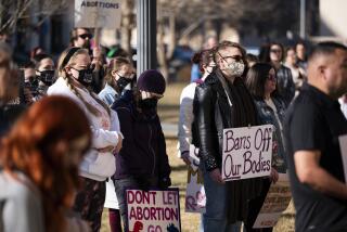 People protest a lawsuit to ban the abortion drug mifepristone at the Potter County Courthouse Saturday, Feb. 11, 2023, in Amarillo, Texas. (AP Photo/Justin Rex)