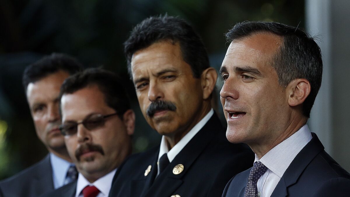 L.A. Mayor Eric Garcetti, right, stands next to city Fire Chief Ralph M. Terrazas.