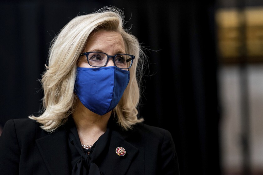 Rep. Liz Cheney in a blue mask