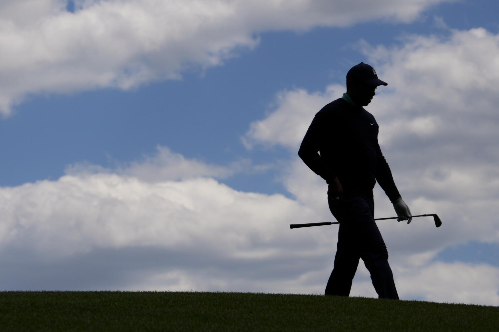 Tiger Woods walks on the fourth fairway during the second round at the Masters golf tournament