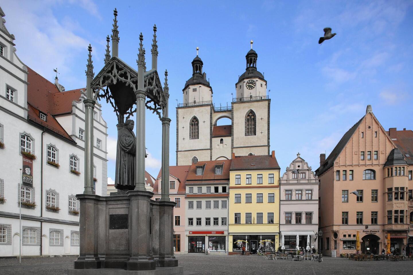 A statue of 16th-century theologian Martin Luther stands on Marktplatz square in Wittenberg, where Luther nailed his 95 theses to a door of the nearby Castle Church in 1517.