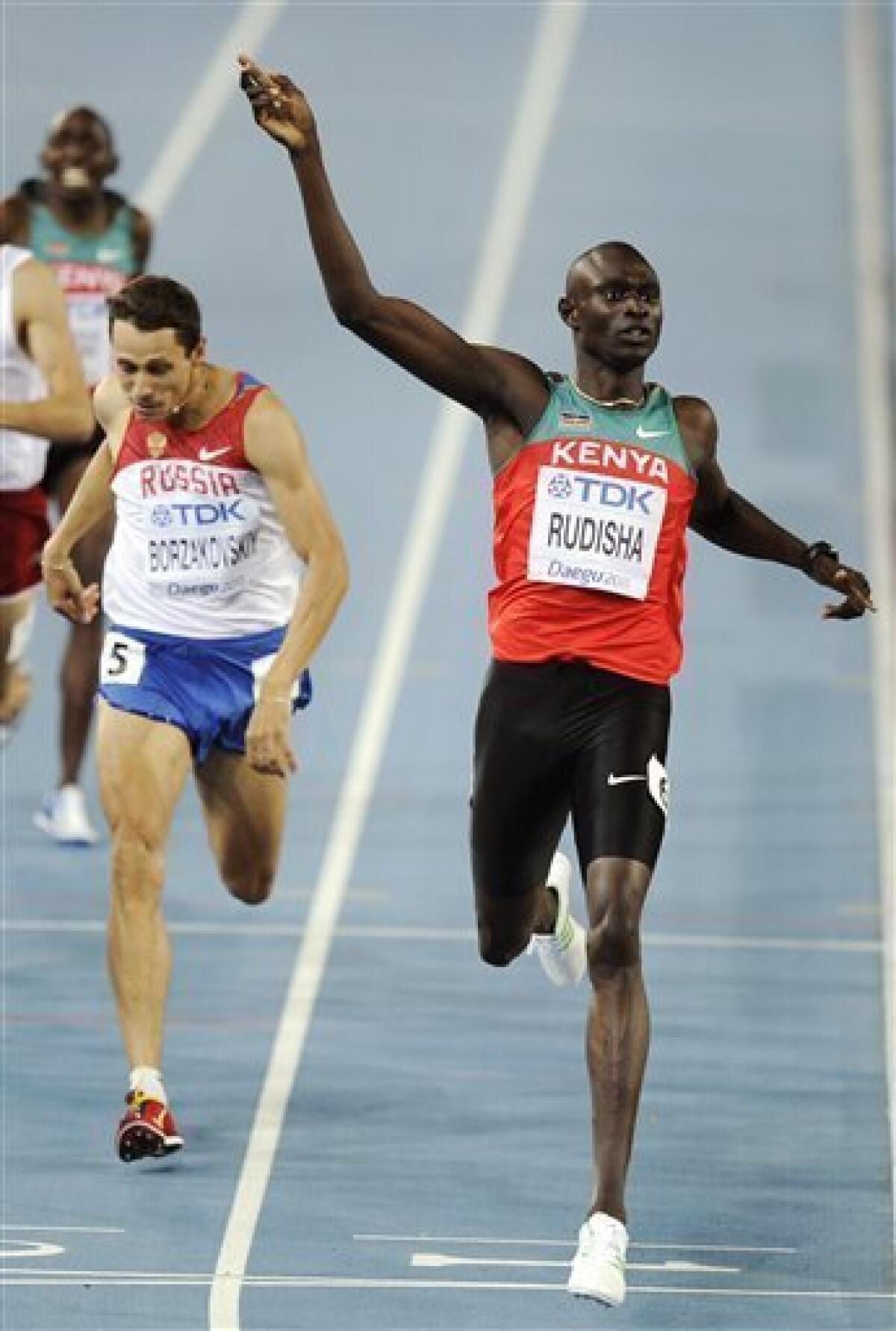 Kenya's David Lekuta Rudisha, right, reacts as he crosses the finish line ahead of Russia's Yuriy Borzakovskiy in the Men's 800m final at the World Athletics Championships in Daegu, South Korea, Tuesday, Aug. 30, 2011. (AP Photo/Martin Meissner)