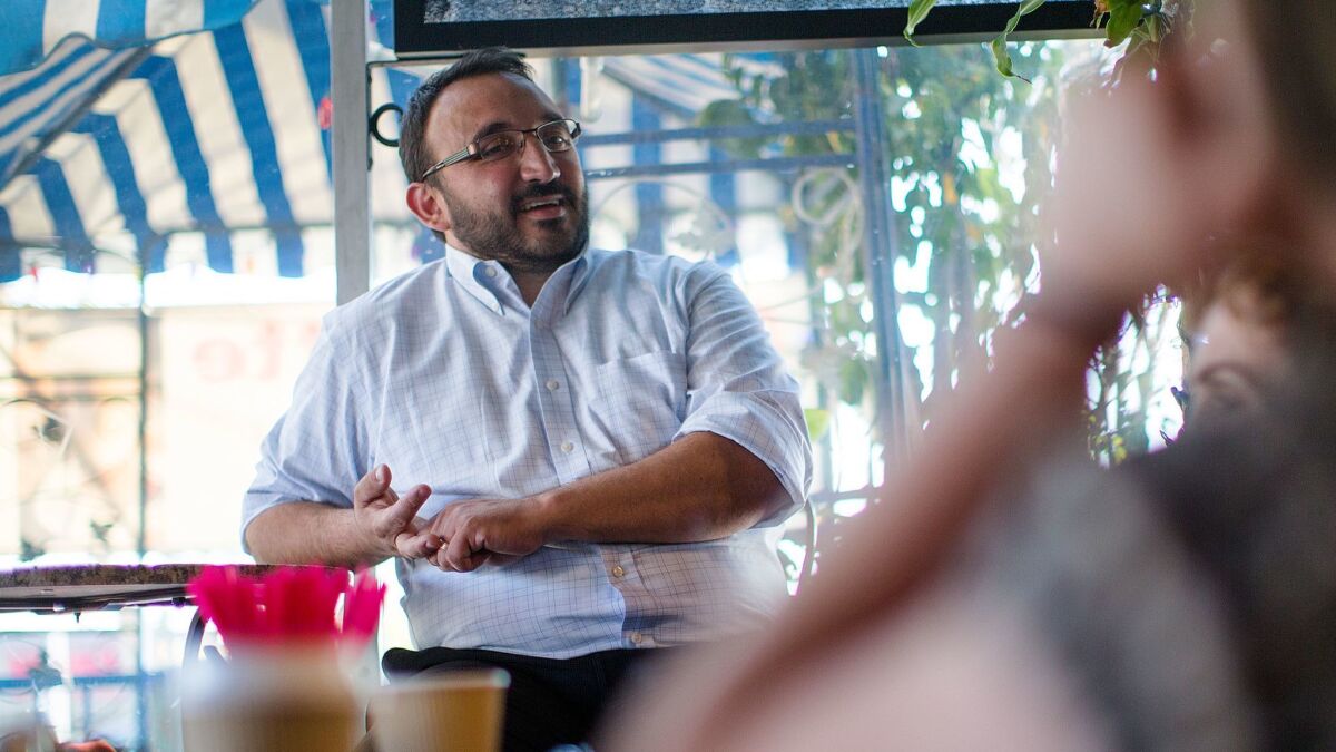 Karo Torossian meets with District 7 residents last week at a coffee shop in Sylmar. (Gina Ferazzi / Los Angeles Times)