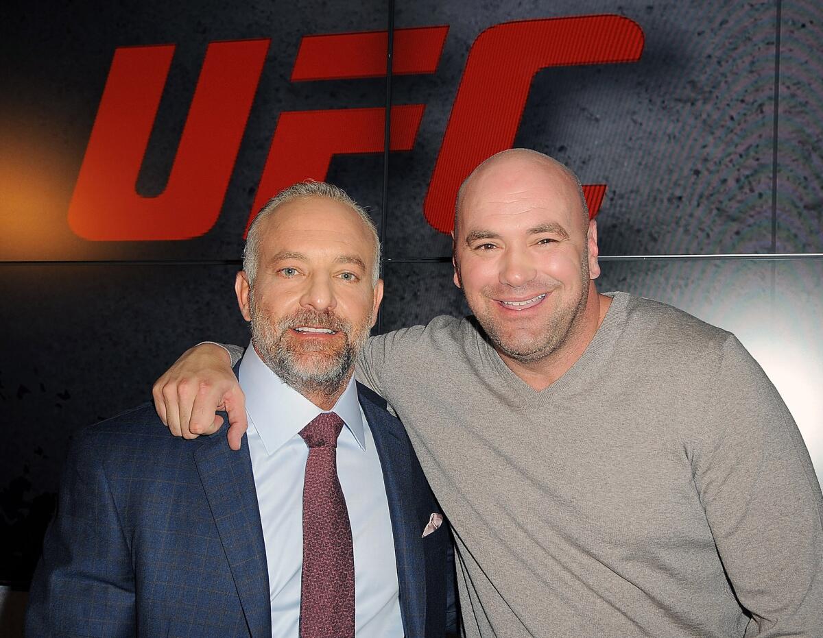 UFC President Dana White, right, and co-owner Lorenzo Fertitta attend a news conference announcing a sponsorship deal with Reebok in New York on Dec. 2, 2014.