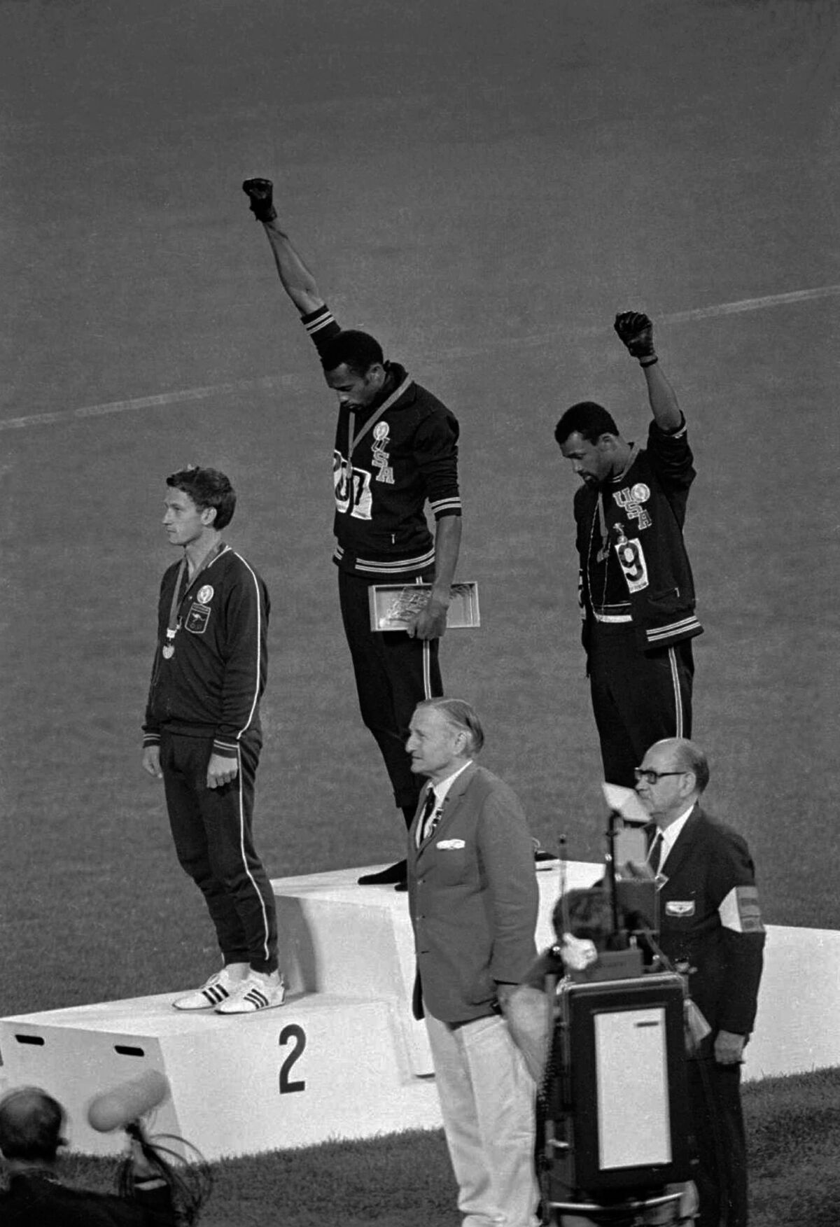 U.S. athletes Tommie Smith and John Carlos raise their gloved fists
