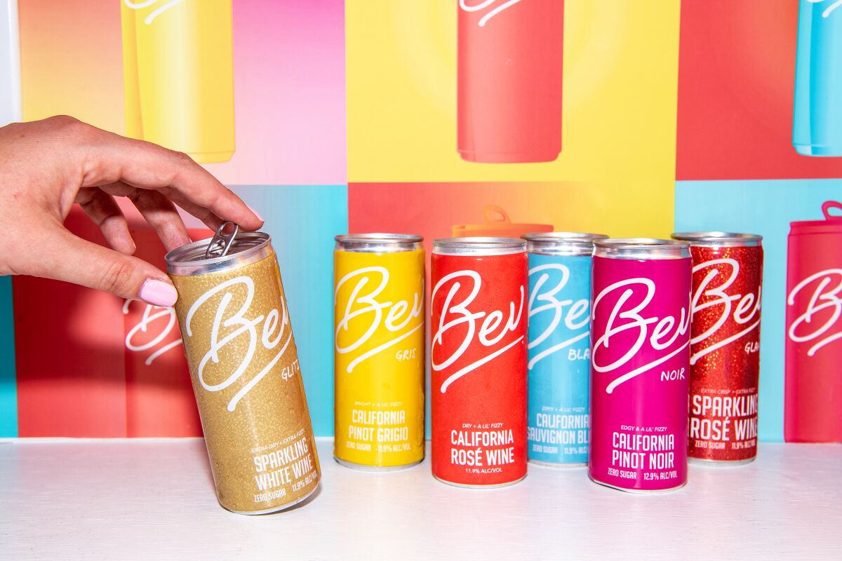 Several colorful cans of wine