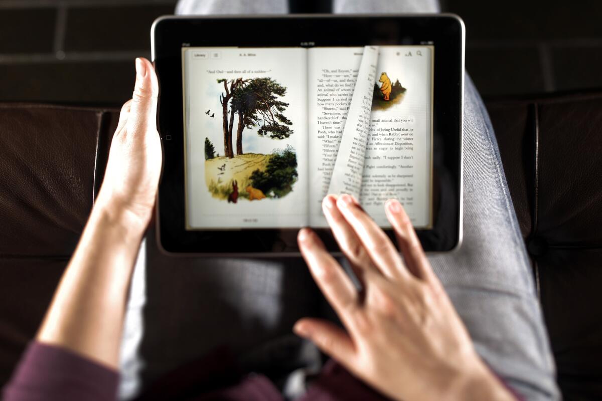 The turning of pages is demonstrated on the Apple iPad, which launched in 2010 with an emphasis on its e-book collection.