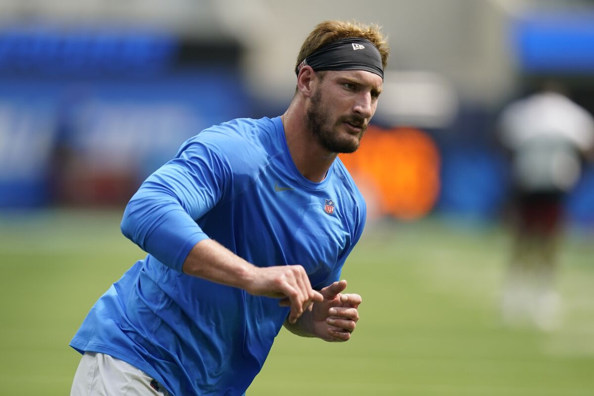 Los Angeles Chargers defensive end Joey Bosa warms up before a preseason NFL football game.
