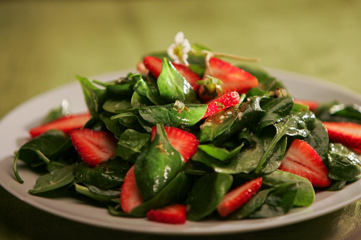 Spinach and strawberry salad with thyme-infused vinaigrette. 