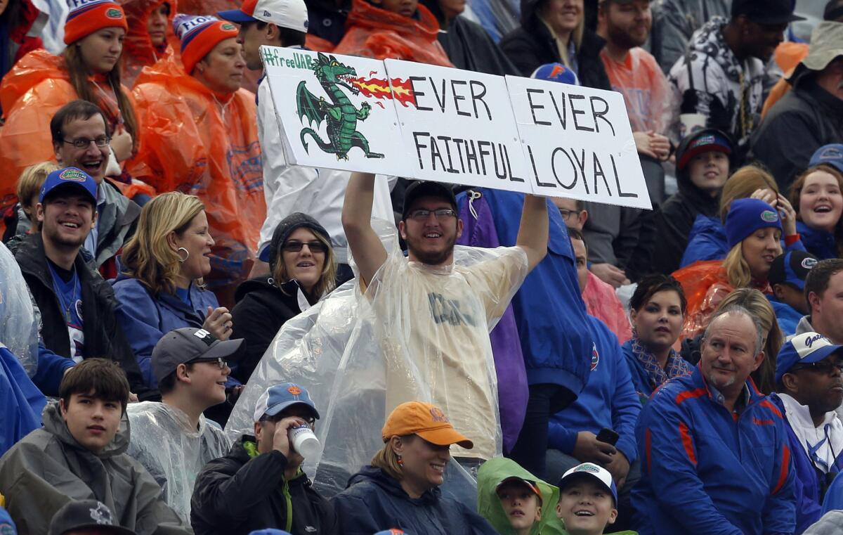 A UAB football fan declares his loyalty to the terminated football program during the Birmingham Bowl game between Florida and East Carolina on Jan. 3, 2015.