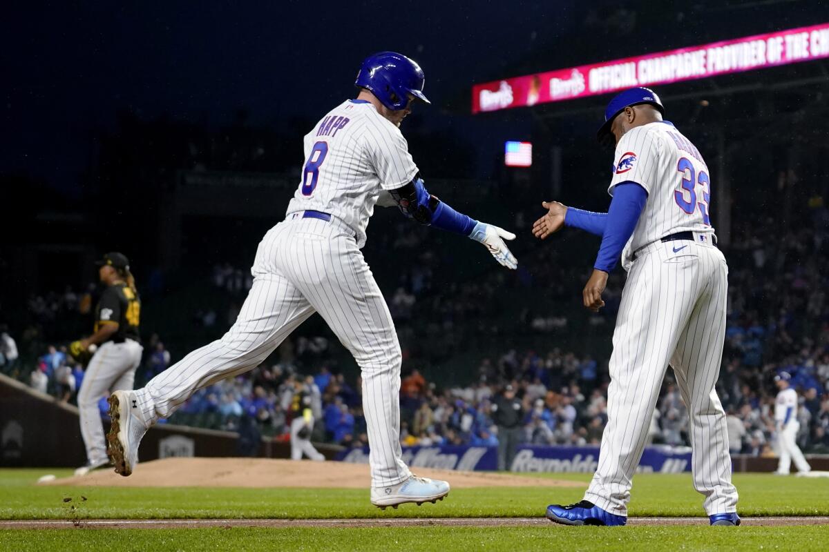 Happ's homer, 4 RBIs lead Cubs over Pirates 11-3 after rain delay