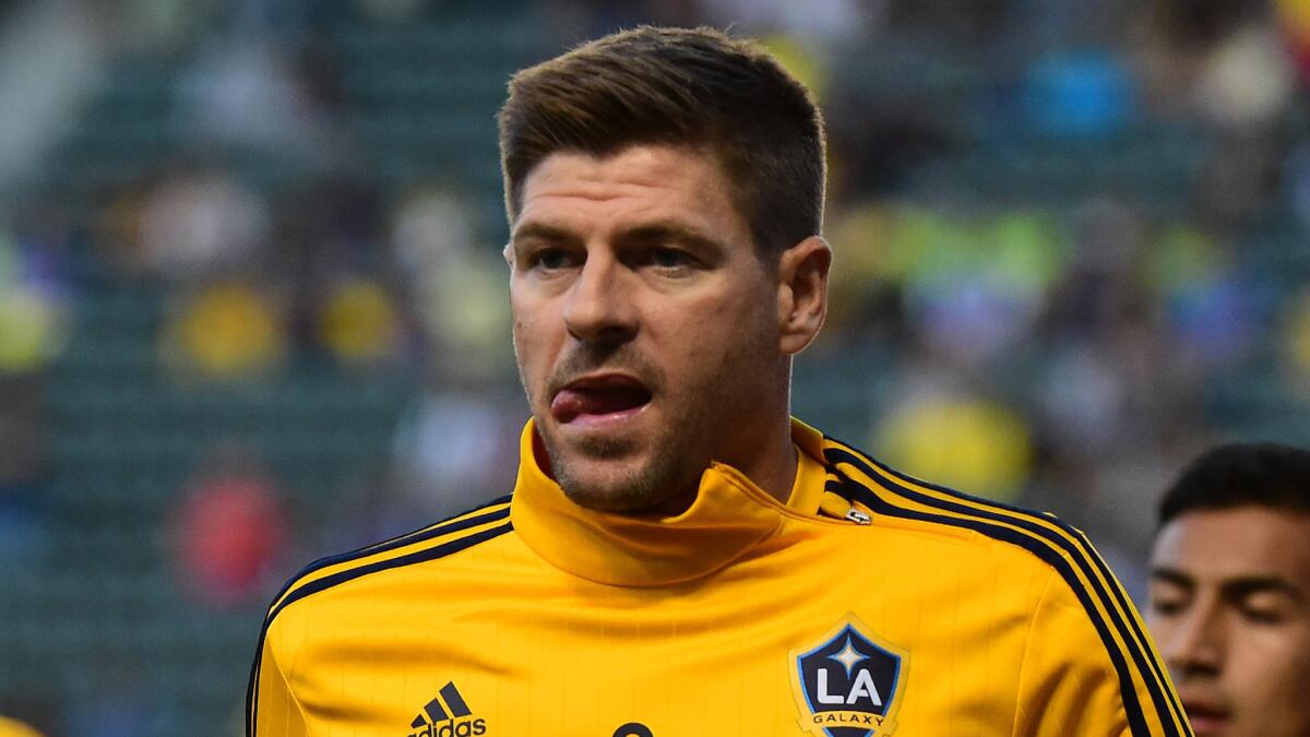 Galaxy midfielder Steven Gerrard warms up before a match against Club America at the StubHub Center in Carson on Saturday.