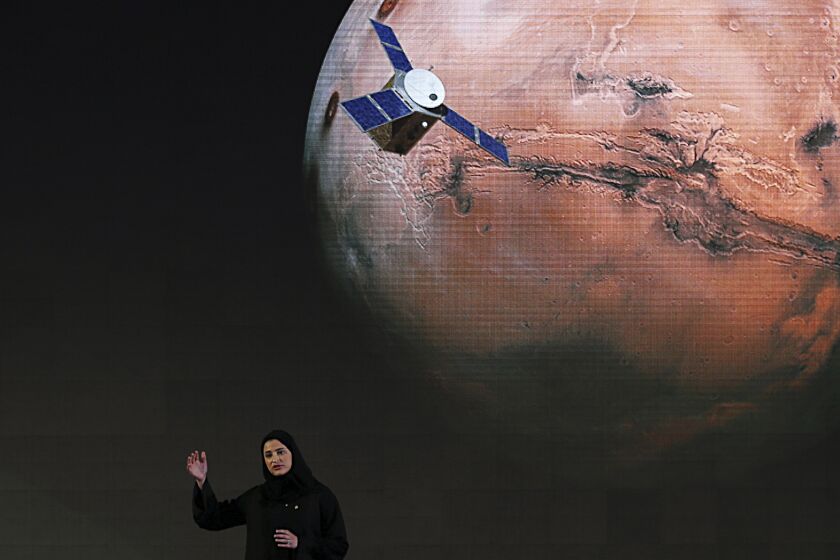 FILE - In this Wednesday, May 6, 2015 file photo, Sarah Amiri, deputy project manager of the United Arab Emirates Mars mission, talks about the project named "Hope," or "al-Amal" in Arabic, which is scheduled for launch in 2020, during a ceremony in Dubai, UAE. Three countries — the United States, China and the United Arab Emirates — are sending unmanned spacecraft to the red planet in quick succession beginning in July 2020. (AP Photo/Kamran Jebreili, File)